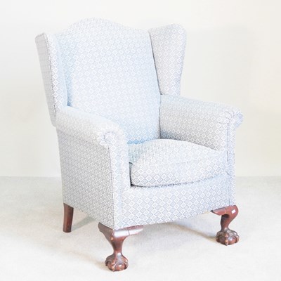 Lot 94 - A 1920s blue upholstered wing armchair, on...