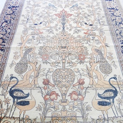 Lot 167 - An Indian woollen carpet, decorated with a...