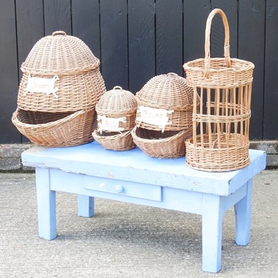 Lot 414 - A set of three French wicker storage baskets,...