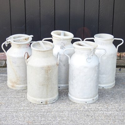 Lot 640 - A collection of five French metal milk churns,...