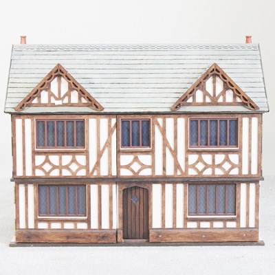 Lot 88 - A painted wooden dolls' house, in the form of...