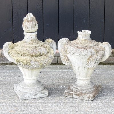 Lot 8 - A pair of weathered cast stone garden urns,...