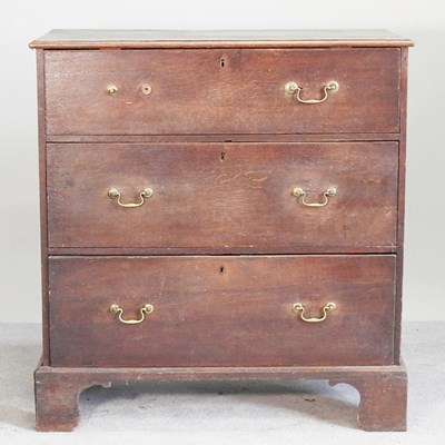 Lot 333 - A George III oak chest, containing three long...