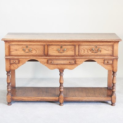 Lot 11 - An oak dresser base, of 18th century design,...