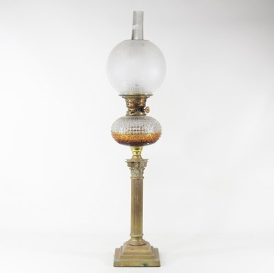 Lot 28 - A 19th century brass oil lamp, in the form of...