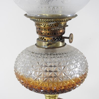 Lot 28 - A 19th century brass oil lamp, in the form of...