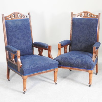 Lot 401 - A pair of Edwardian carved walnut and blue...