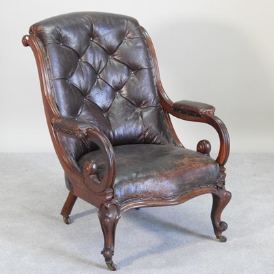 Lot 141 - A Victorian leather upholstered armchair, with...