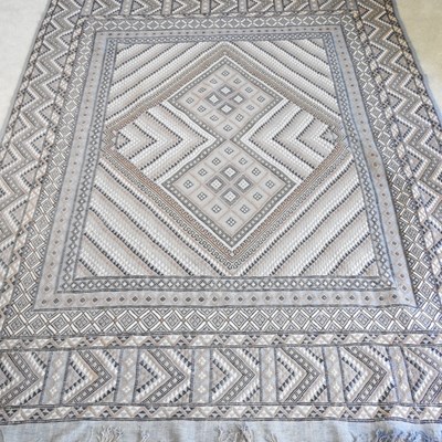 Lot 645 - A grey Afghan rug, with all over geometric...