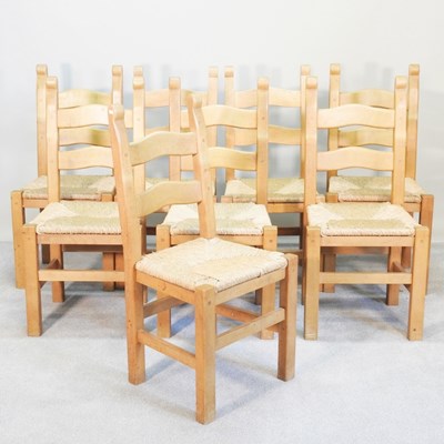 Lot 378 - A set of eight rush seated ladder back dining...