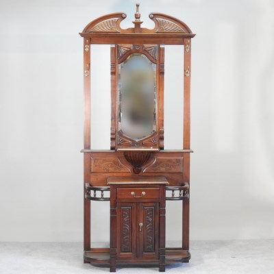 Lot 237 - An Edwardian style hardwood hall stand, with a...