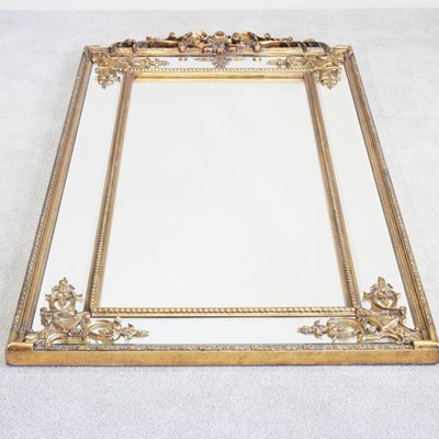 Lot 99 - A modern ornate gilt framed wall mirror, with...