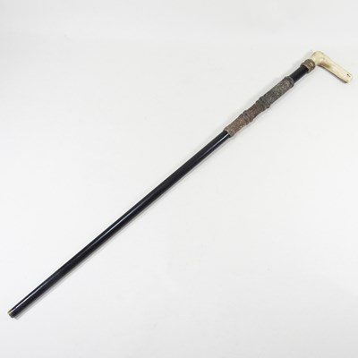 Lot 149 - A late 19th century air cane, with an antler...
