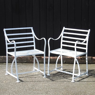 Lot 1 - A pair of Regency style white painted wrought...