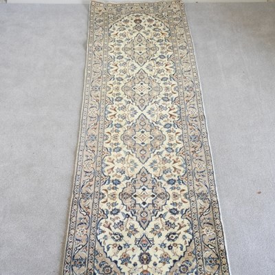 Lot 609 - A Persian kashan runner, with scrolling...