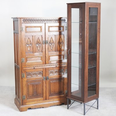 Lot 502 - An Old Charm style oak cocktail cabinet,...