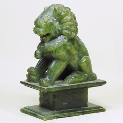 Lot 202 - A Chinese carved soapstone model of a seated...