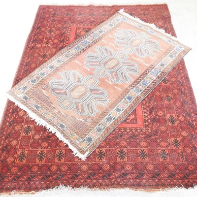 Lot 343 - A Persian rug, on red ground, 199 x 143cm,...