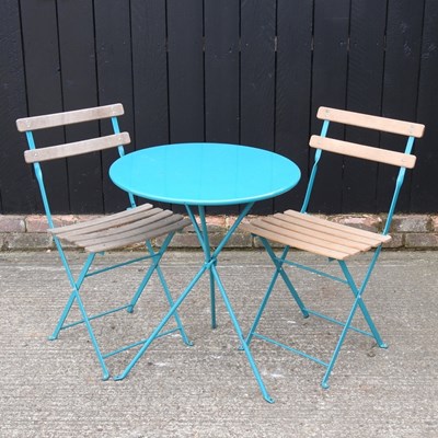 Lot 551 - A blue painted metal folding bistro table,...