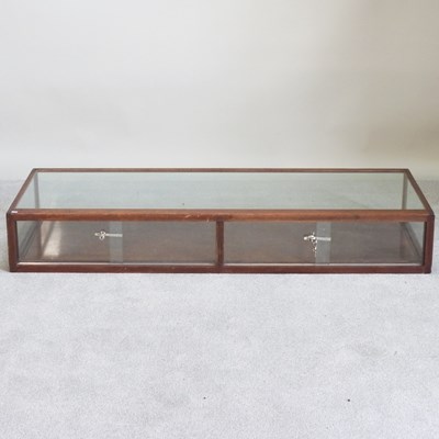 Lot 558 - An early 20th century glazed jewellery table...