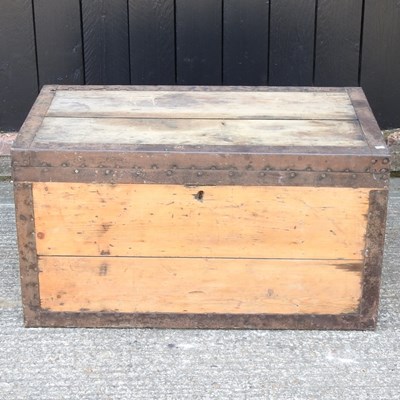 Lot 484 - An antique metal bound trunk, with a hinged lid
