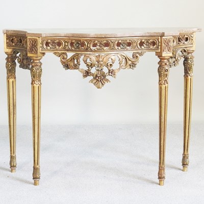 Lot 161 - An ornate Louis XVI style gilt marble top...