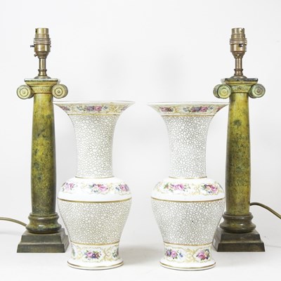 Lot 598 - A pair of table lamps, each in the form of a...