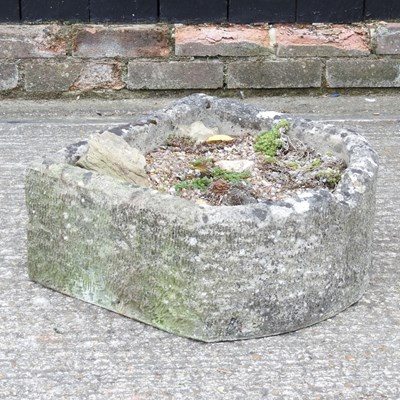 Lot 405 - A carved weathered stone garden trough