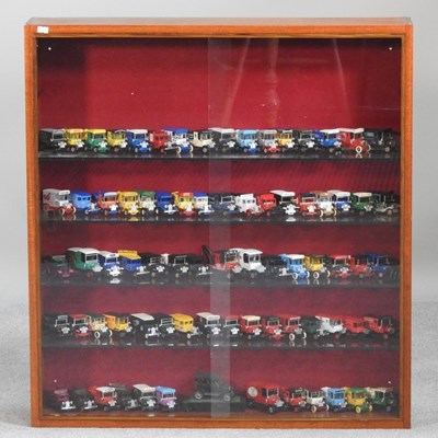 Lot 578 - A teak cabinet containing a collection of die...