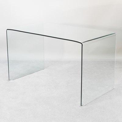 Lot 650 - A contemporary moulded glass console table