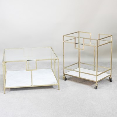 Lot 547 - An Eastern style brass and glass coffee table,...