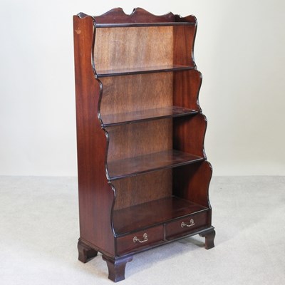 Lot 408 - A 20th century mahogany waterfall bookcase,...