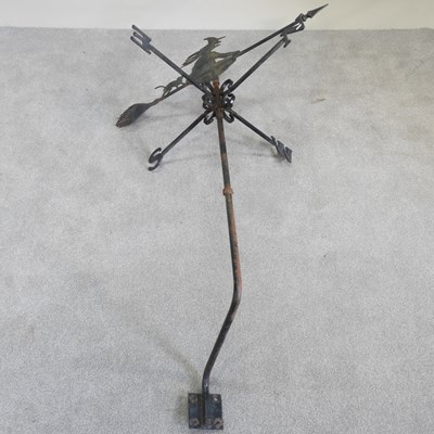 Lot 370 - A black painted iron weather vane, surmounted...