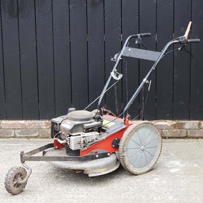 Lot 571 - A petrol brush cutter, with a Briggs &...