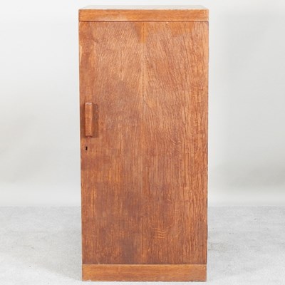 Lot 635 - An early 20th century Heals style light oak...