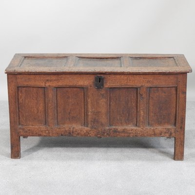 Lot 491 - An 18th century panelled oak coffer, with a...