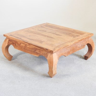 Lot 595 - An Eastern sheesham coffee table, on shaped legs