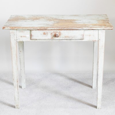Lot 634 - A rustic French painted chestnut side table,...
