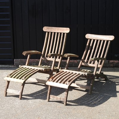Lot 507 - A pair of teak folding steamer chairs (2)