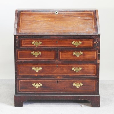 Lot 611 - A George III inlaid bureau, on bracket feet