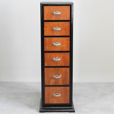 Lot 417 - A 1930s style narrow chest, containing a row...