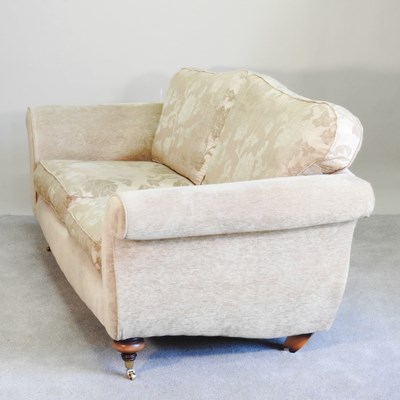 Lot 509 - A modern cream upholstered sofa, with floral...