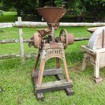 Lot 544 - An early 20th century iron horse drawn corn mill