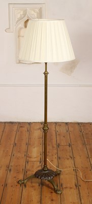 Lot 671 - An early 20th century brass standard lamp,...