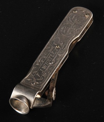 Lot 135 - A silver cigar cutter, with fold out knives...