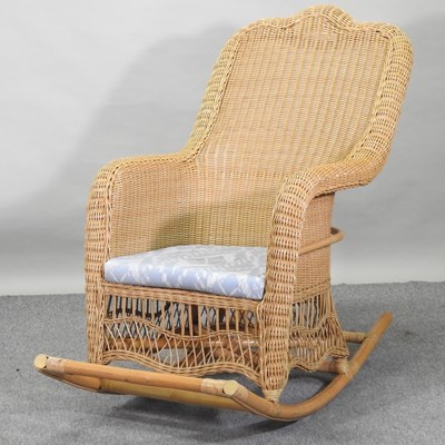 Lot 87 - A 20th century wicker rocking chair
