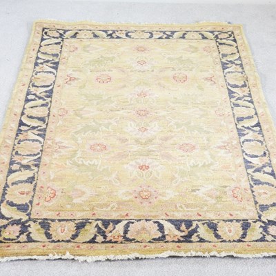 Lot 293 - A modern Indian woollen carpet, with scrolling...