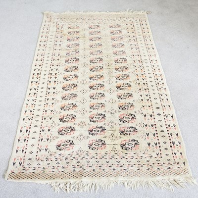 Lot 424 - A bokhara rug, with three rows of medallions,...
