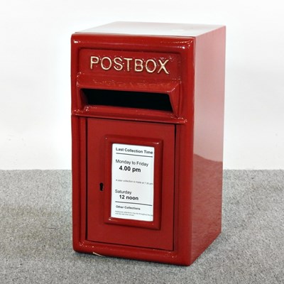 Lot 565 - A red painted metal post box, 44cm high