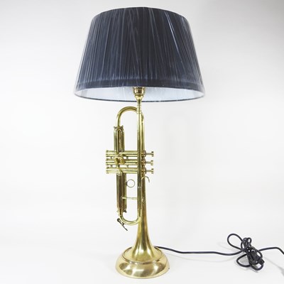 Lot 383 - A trumpet table lamp and shade, 75cm high overall